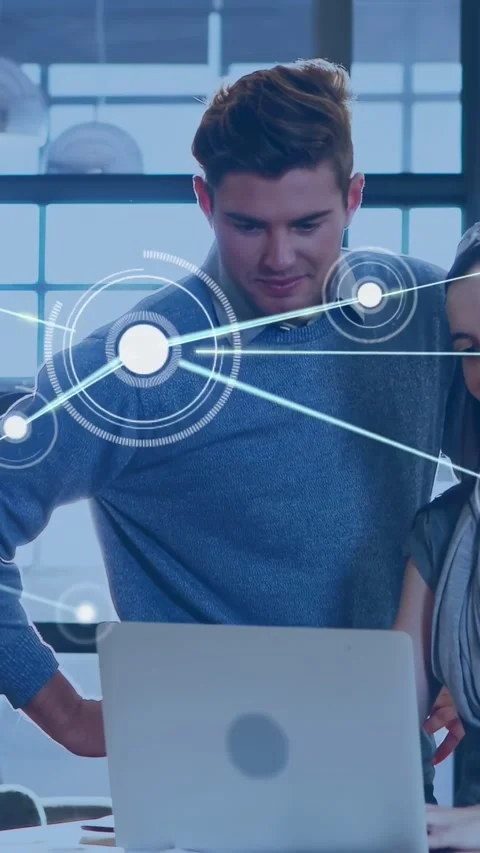 Vertical video: Dot appearing on laptop sparking team leaning watching nodes Stock Footage 334317886