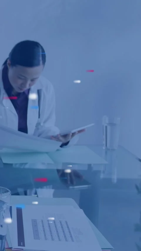 Vertical video: Dr opening folder reviewing files for consult on tablet, Stock Footage 332806849
