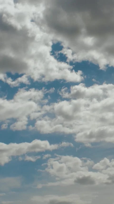 Vertical video. Dramatic and beautiful blue cloudy sky with striking blue spots Stock Footage 311457089