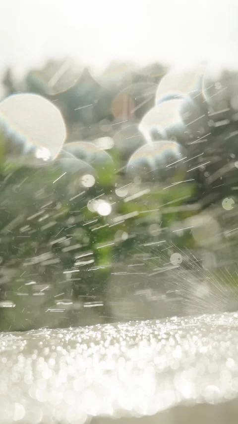 Vertical video. Dramatic Water Droplets Exploding on White Surface in Close-Up Stock Footage 311012929