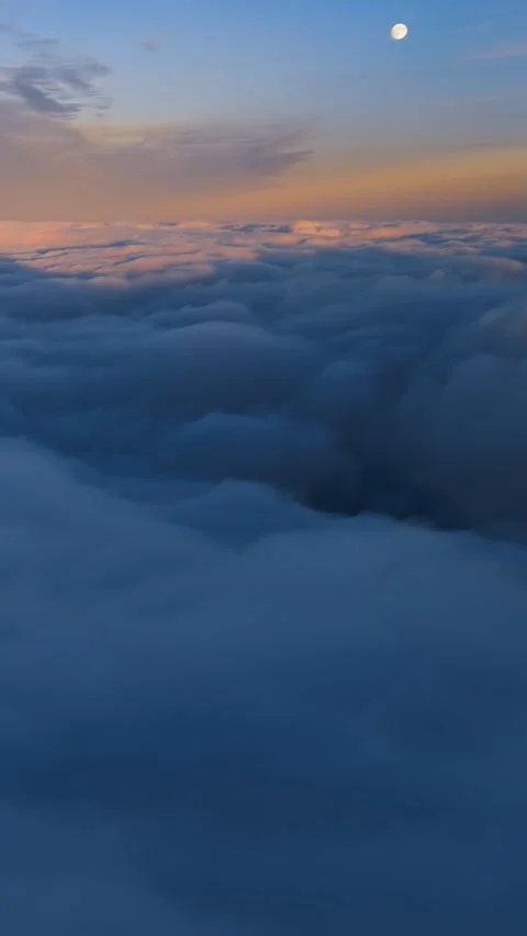 Vertical video of dreamy clouds sky heaven in magic morning at blue hour Stock Footage 295042152