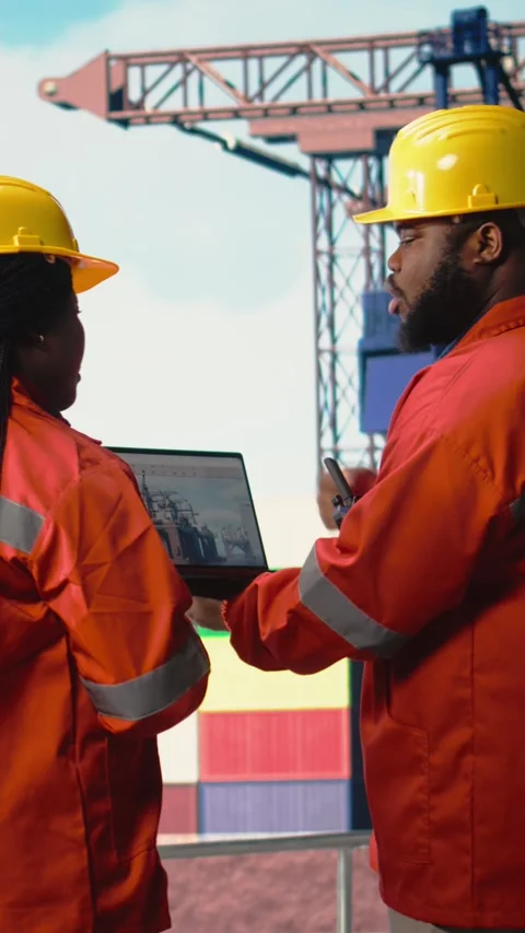 Vertical video Drilling rig boat engineering team using laptop to monitor Stock Footage 319450677