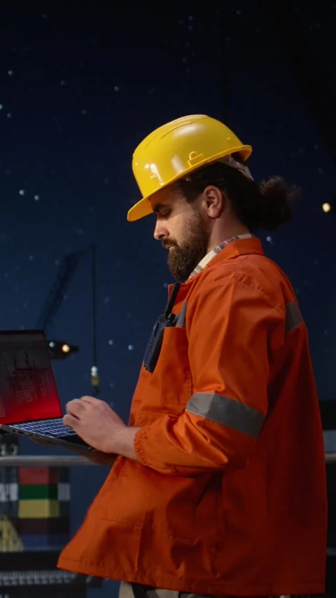 Vertical video Drilling ship men using laptop to monitor defects during war Stock Footage 339888039