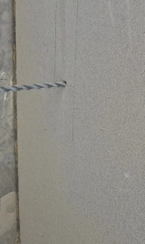 Vertical video of drilling wall hole for AC installation Stock Footage 338020267