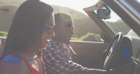 Vertical video: Driver using map then folding, steering while woman smiling, Stock Footage 332281945