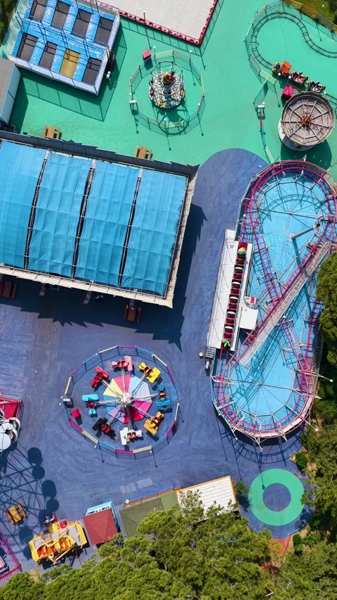 Vertical Video Drone Shot of Theme Park with Roller Coaster Track Stock-Footage 342084347