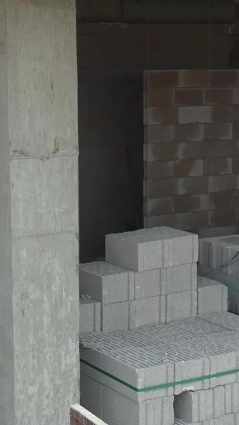 Vertical Video Drone View of Construction Process with Materials and Equipment Stock Footage 341919818