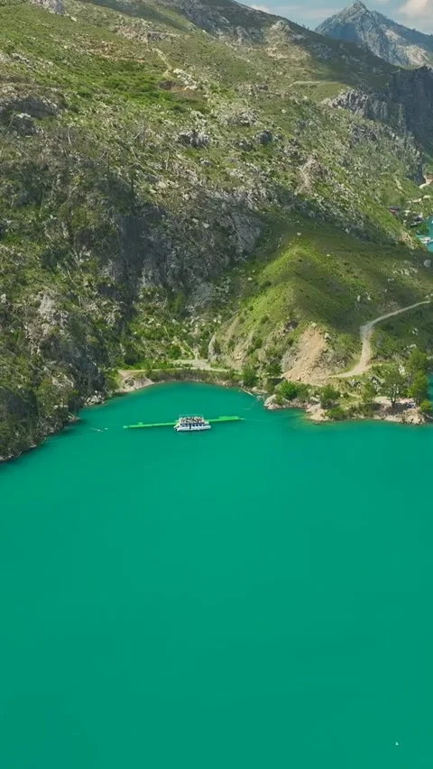 Vertical Video Drone View of Leisure Boat in Mountain River Landscape 库存影片 342046803