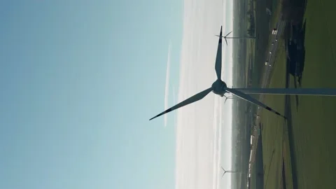 Vertical video drone view windmills wind turbines producing clean electricity Stock Footage 167387484
