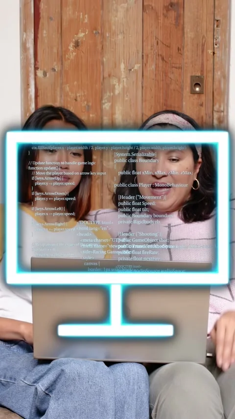 Vertical video: Duo using laptop neon overlay appearing over keyboard code Stock Footage 333236320