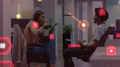 Vertical video: During work lunch, red HUDs drifting over woman eating and man Stock Footage 333965586