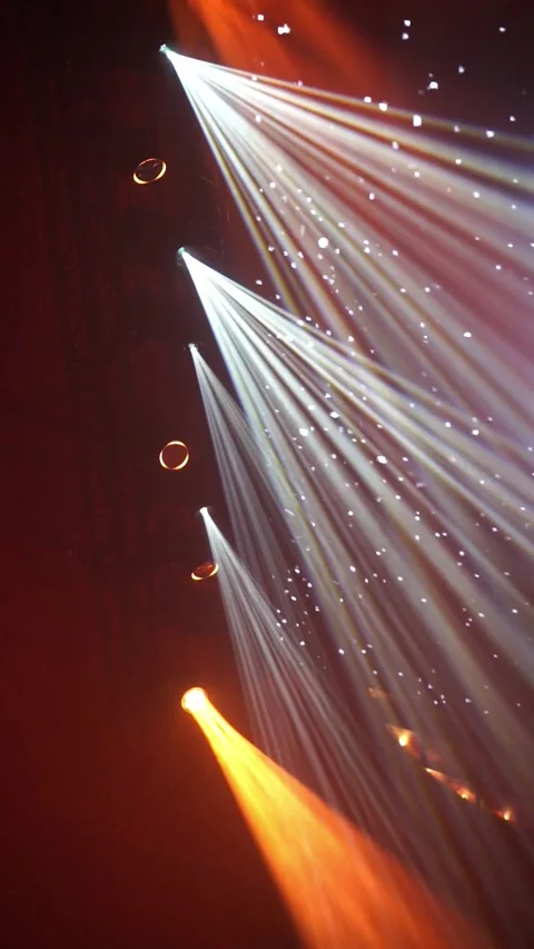 Vertical video of Dynamic light beams illuminating stage with vibrant color Stock Footage 322976988