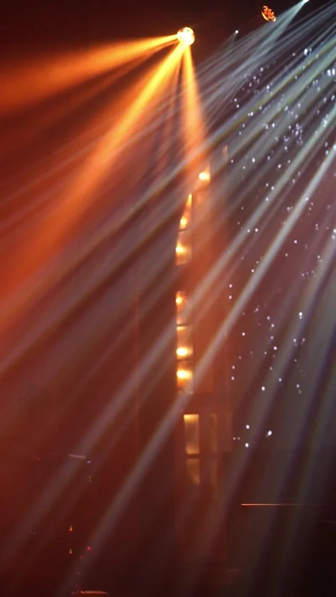 Vertical video of Dynamic light beams illuminate stage with vibrant colors Stock Footage 322977058