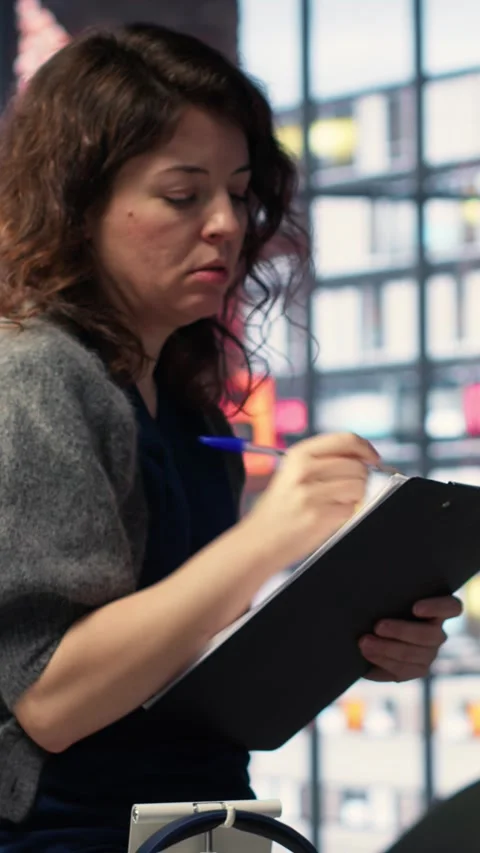 Vertical Video Editors team refines social media content using advanced AI tech Stock Footage 308491362