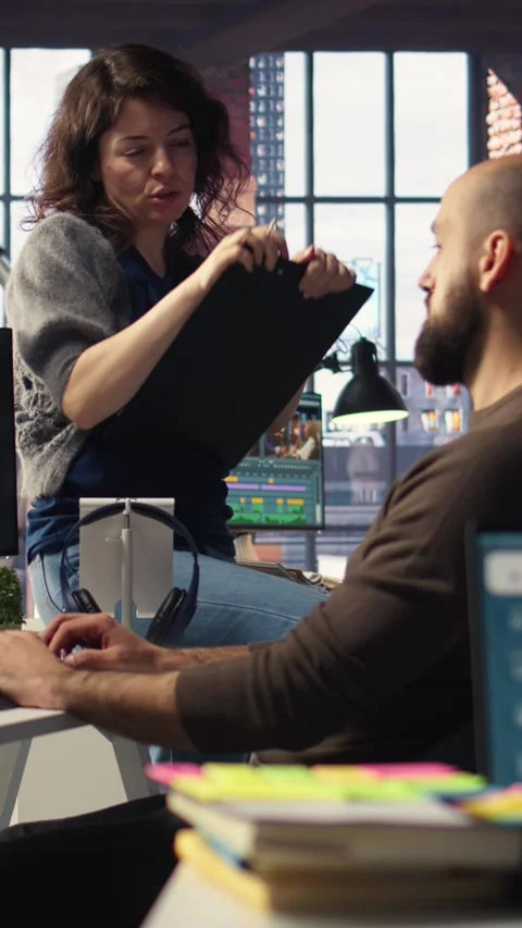 Vertical Video Editors team refines social media content using advanced AI tech Stock Footage 308493245