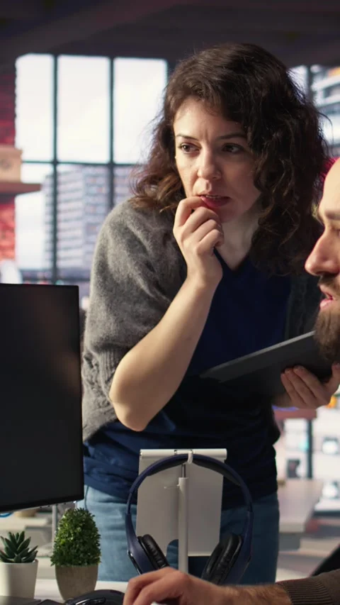 Vertical Video Editors team using videography software to create better content Stock Footage 308490268