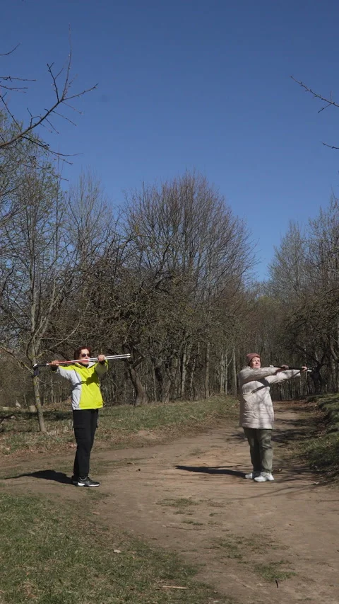 Vertical video of elderly and young Caucasian woman training in park. Stock Footage 330538984