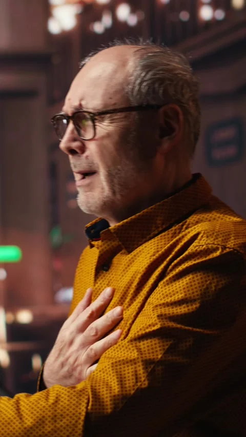 Vertical Video Elderly college student does inhale exhale exercise due to 스톡 동영상 313245992