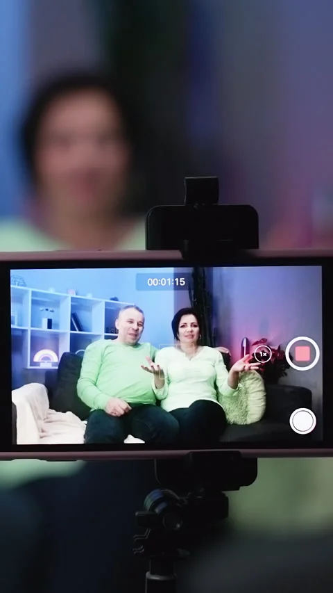Vertical Video of Elderly couple using smartphone video conference with Stock Footage 303139568