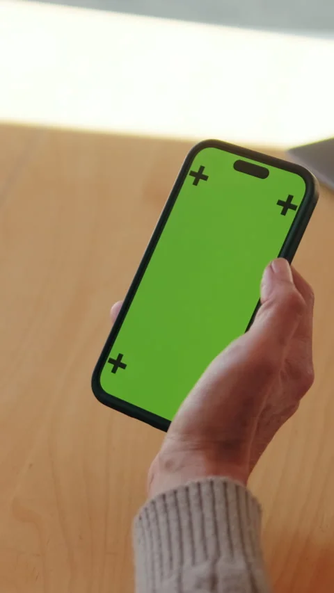 Vertical video, Elderly Woman Using Green Screen Smartphone Stock Footage 303290054
