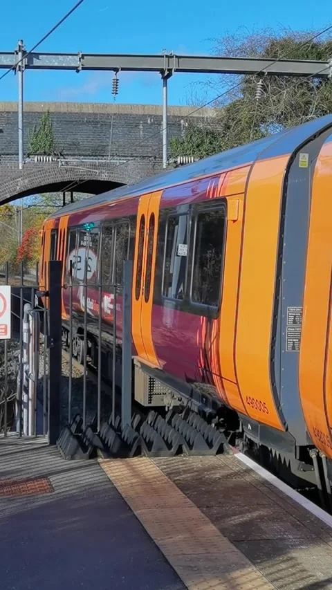 Vertical video electrified passenger commuter train - EXCLUSIVE TO POND5 Stock Footage 289633964