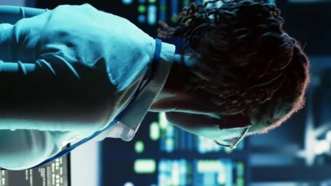 Vertical video Employee programming in data center Stock Footage 250361701
