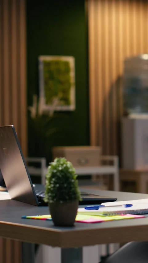 Vertical Video Empty corporate workspace with stylish office design illuminated Stock Footage 334104478