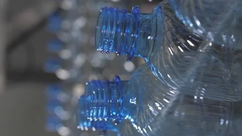 Vertical video. Empty plastic bottles are moved on a conveyor belt. Video stock 234211971