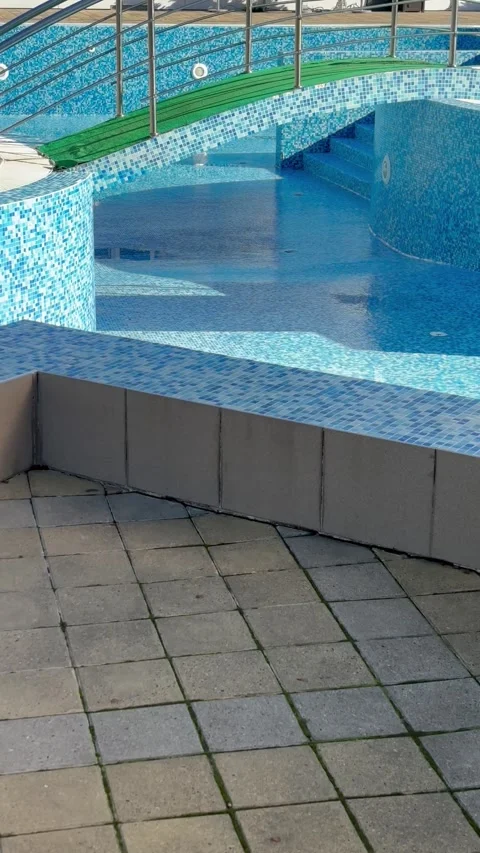 Vertical video. Empty swimming pool. Closed down swimming pool, restriction. Cle Stock Footage 303560729