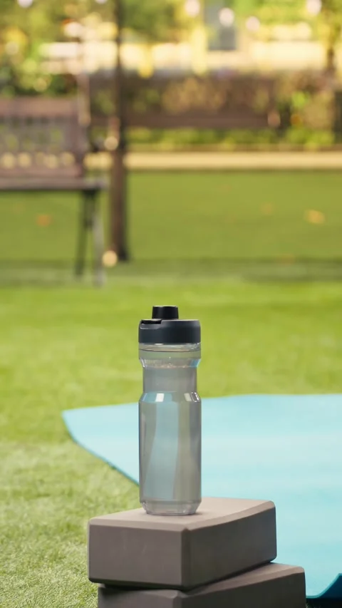 Vertical Video Empty yoga and fitness setup in city park close to yoga mats Stock Footage 346614678