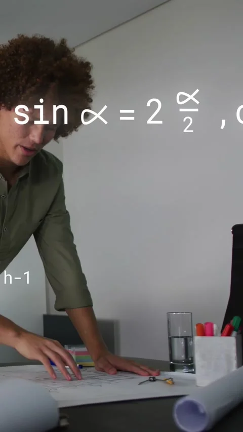 Vertical video: Engineer aligning plans at desk designing, metal disk passing Stock Footage 333289346