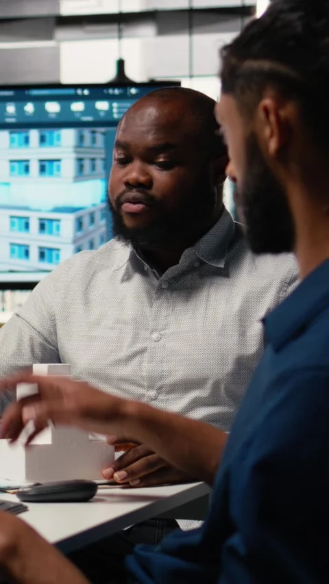Vertical Video Engineer and designer working together on real estate interior Stock Footage 316342347