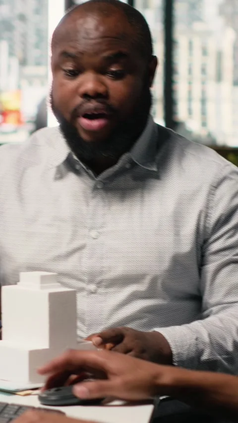 Vertical Video Engineer and designer working together on real estate interior Stock Footage 316342454