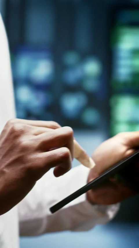 Vertical video Engineer in blockchain server room Stock Footage 245914405