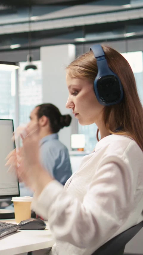 Vertical video Engineer coding with AI language model assistance in office Stock Footage 312708736