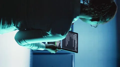Vertical video Engineer coding in data center Stock Footage 250360265
