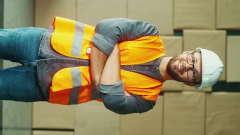 Vertical Video An Engineer in Hard Hat and Safety Vest Works Stock Footage 311578789