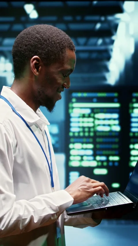 Vertical video Engineer inspecting server network Stock Footage 245917608