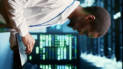 Vertical video Engineer inspecting server network Stock Footage 245953434