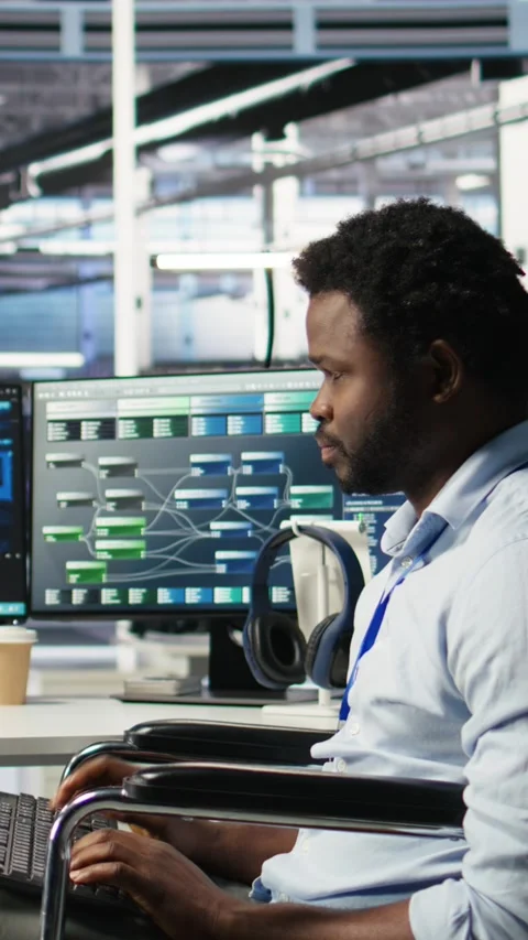 Vertical video Engineer with paraplegia in data center panicked by AI node tree Video stock 307971325