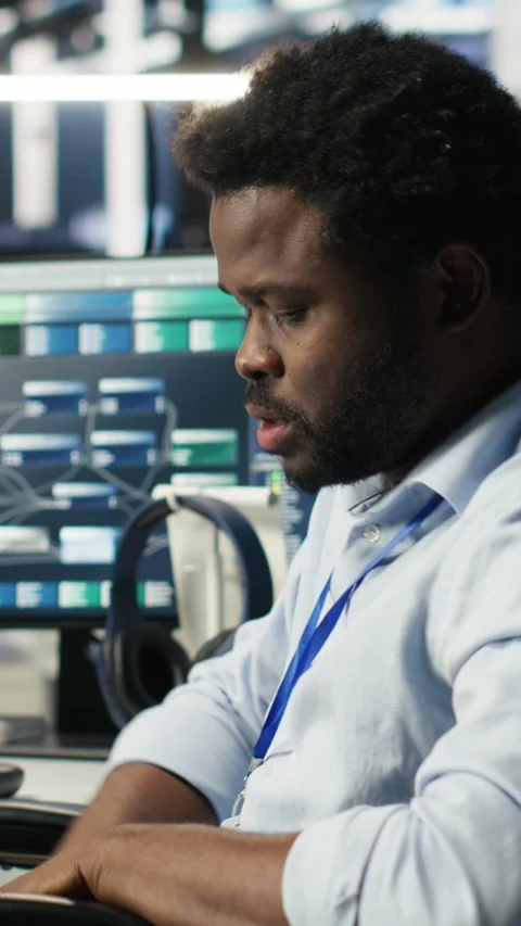 Vertical video Engineer with paraplegia in data center annoyed by slow AI node Stock Footage 308752350