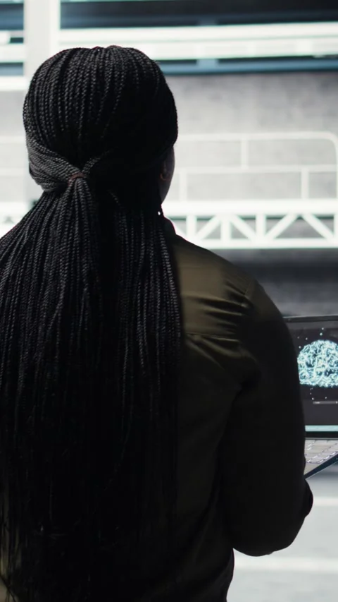 Vertical video Engineer in server hub using laptop to upgrade rigs using AI deep Video stock 316856369