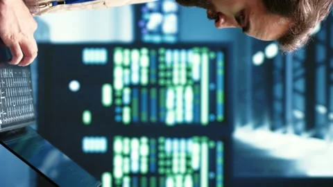 Vertical video Engineer servicing VPN servers Stock Footage 245953539