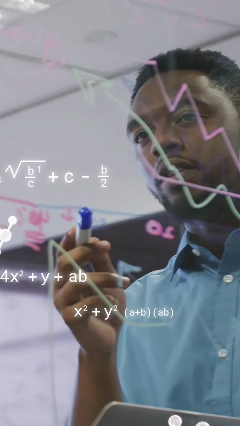 Vertical video: Engineer studying glass board, tracing curve, animating math, Stock Footage 333954324