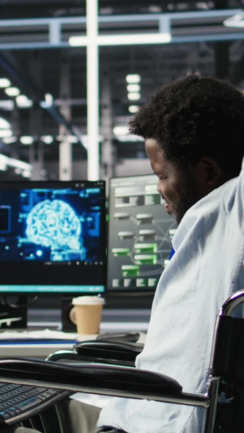 Vertical video Engineer using wheelchair in data center using AI node tree Stock Footage 307970062