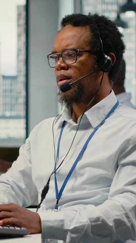 Vertical video Engineering team in office providing remote diagnostics Stock Footage 323330560