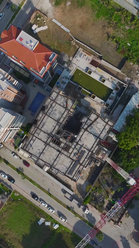 Vertical Video: Engineers and Workers Collaborating on Wall Building Using Tools Stock Footage 342600854
