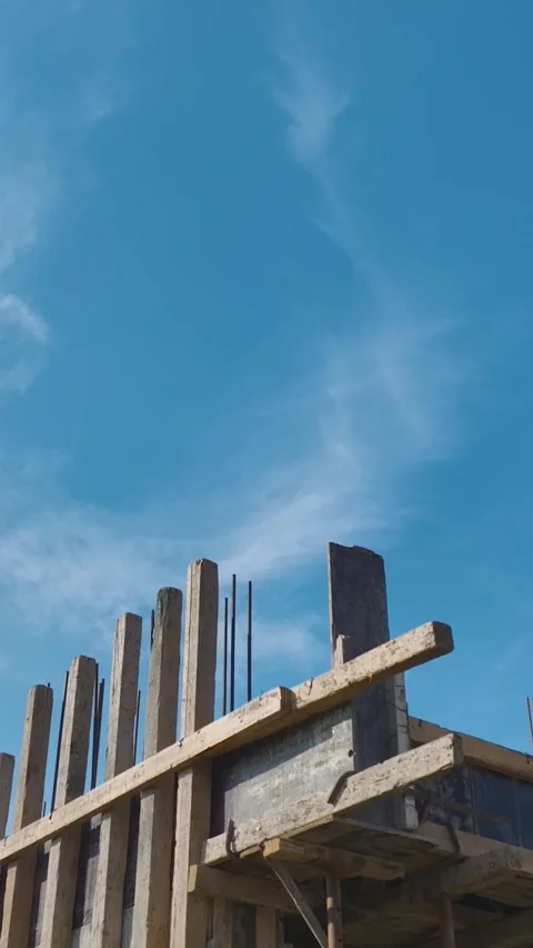 Vertical Video: Engineers and Workers Collaborate to Build Walls, Handle Stock Footage 342913030