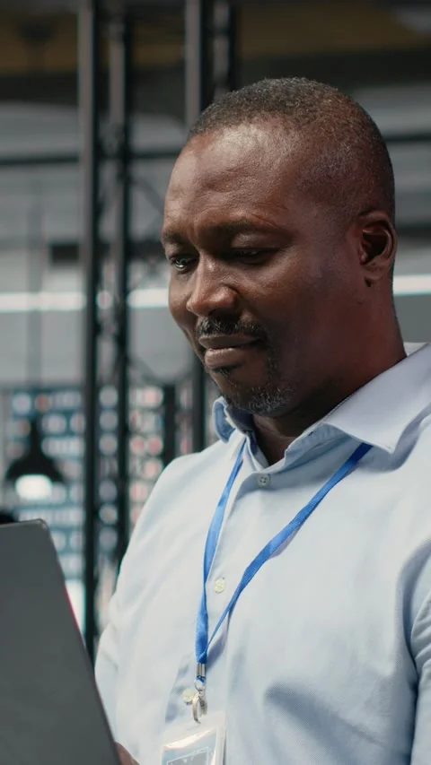 Vertical video Engineers in office doing software development to launch new Stock Footage 323403467