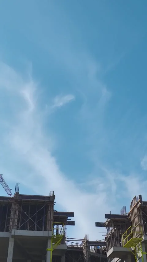 Vertical Video: Engineers Oversee Construction Teams Building Walls and Using Stock Footage 342911261
